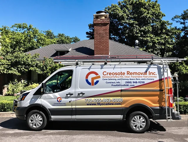 Lincoln Chimney Sweep technician removing creosote safely in Lincoln, RI
