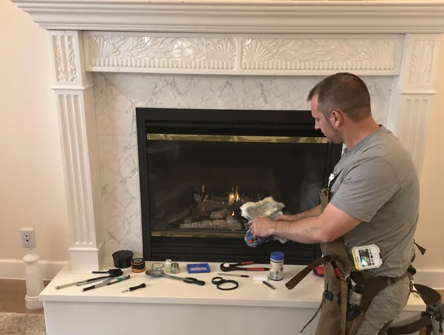 Lincoln Chimney Sweep performing fireplace maintenance in Lincoln, RI